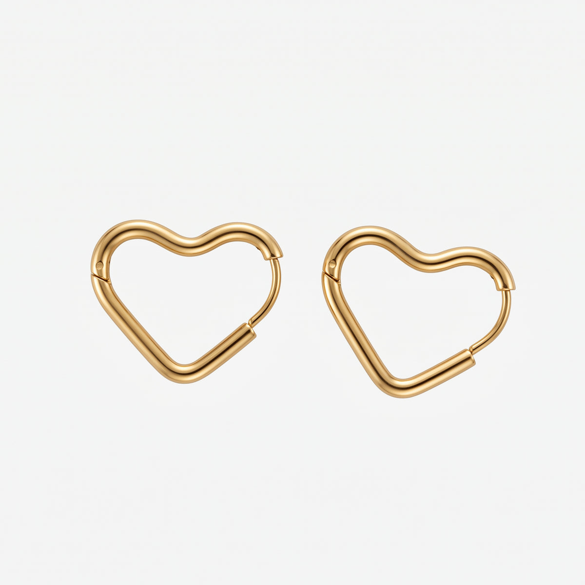 THE CHEL™ Heart Huggie Earrings